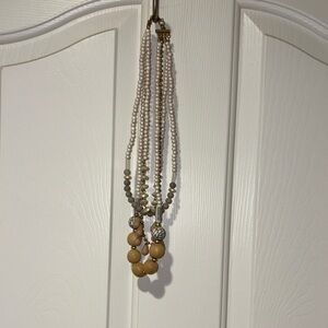 Adjustable 4 tier statement necklace by Plunder. White, tan & grey tones.